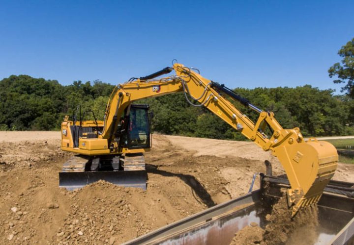 An excavator removing land mass from the construction site